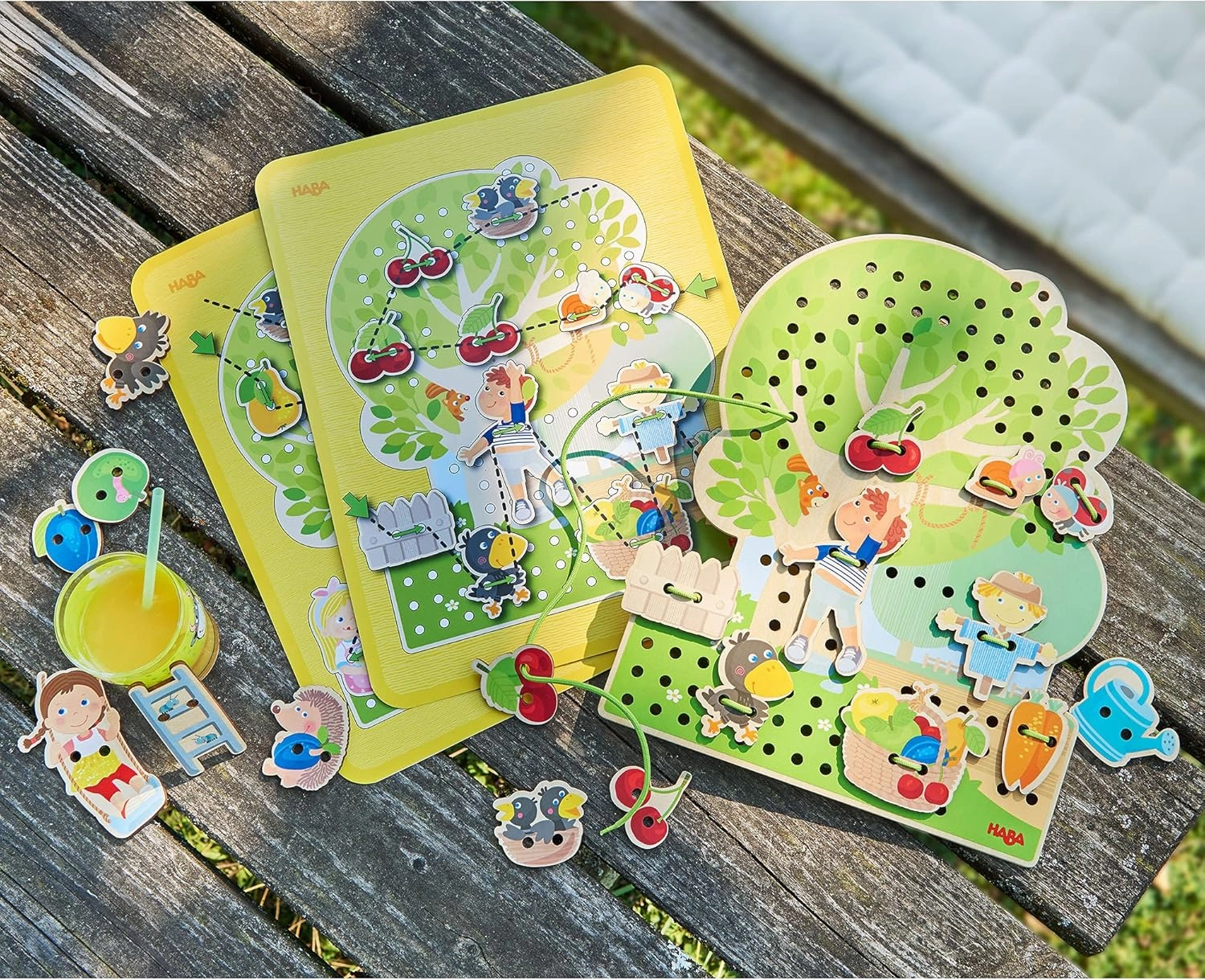 HABA Orchard Threading Game for Kids Ages 3-5, Lacing Tiles for Fine Motor Skills Development, Montessori Learning Toy for Preschoolers with 31 Fruit & Character Tiles