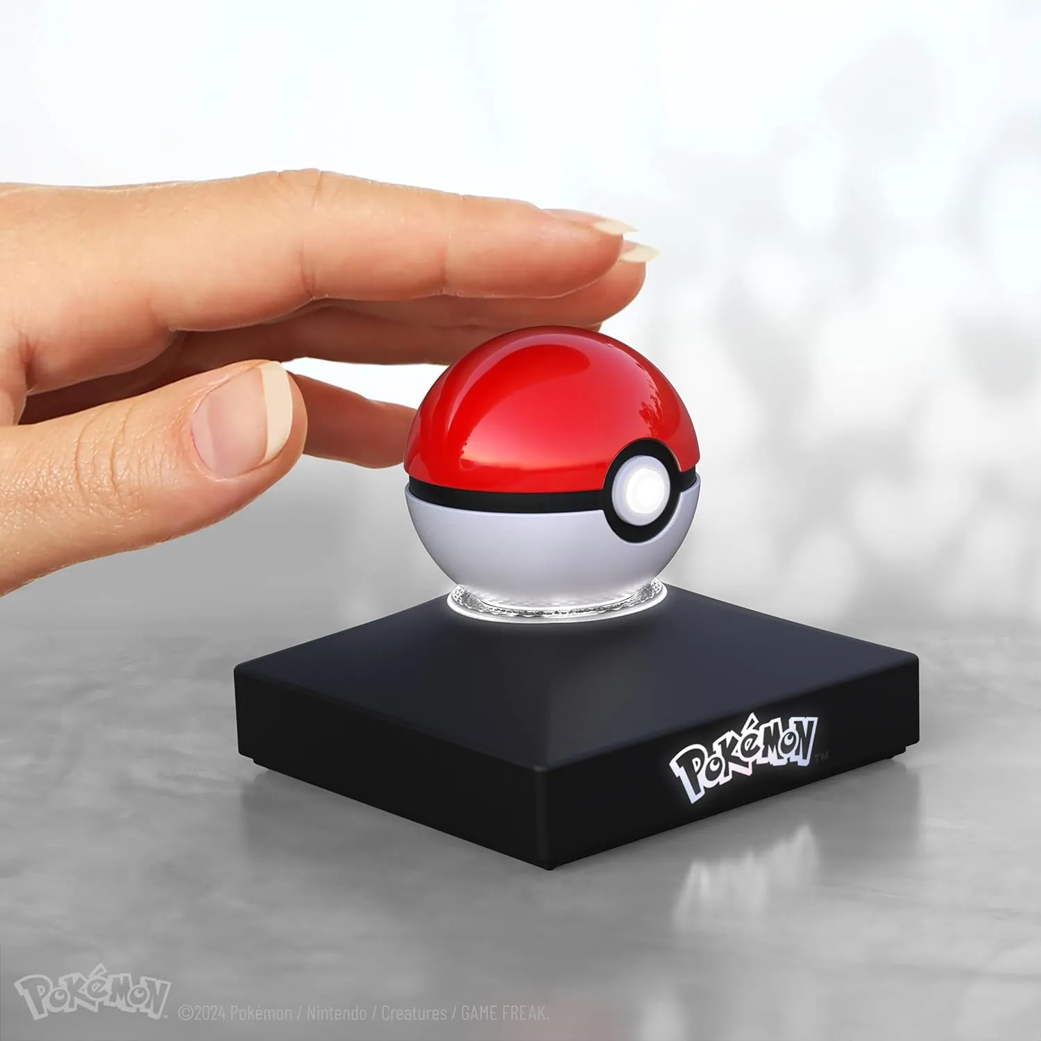 The Wand Company Mini Poké Ball Authentic Replica - Realistic, Electronic, Die-Cast Poké Ball with Display Stand Light Features – Officially Licensed by Pokémon